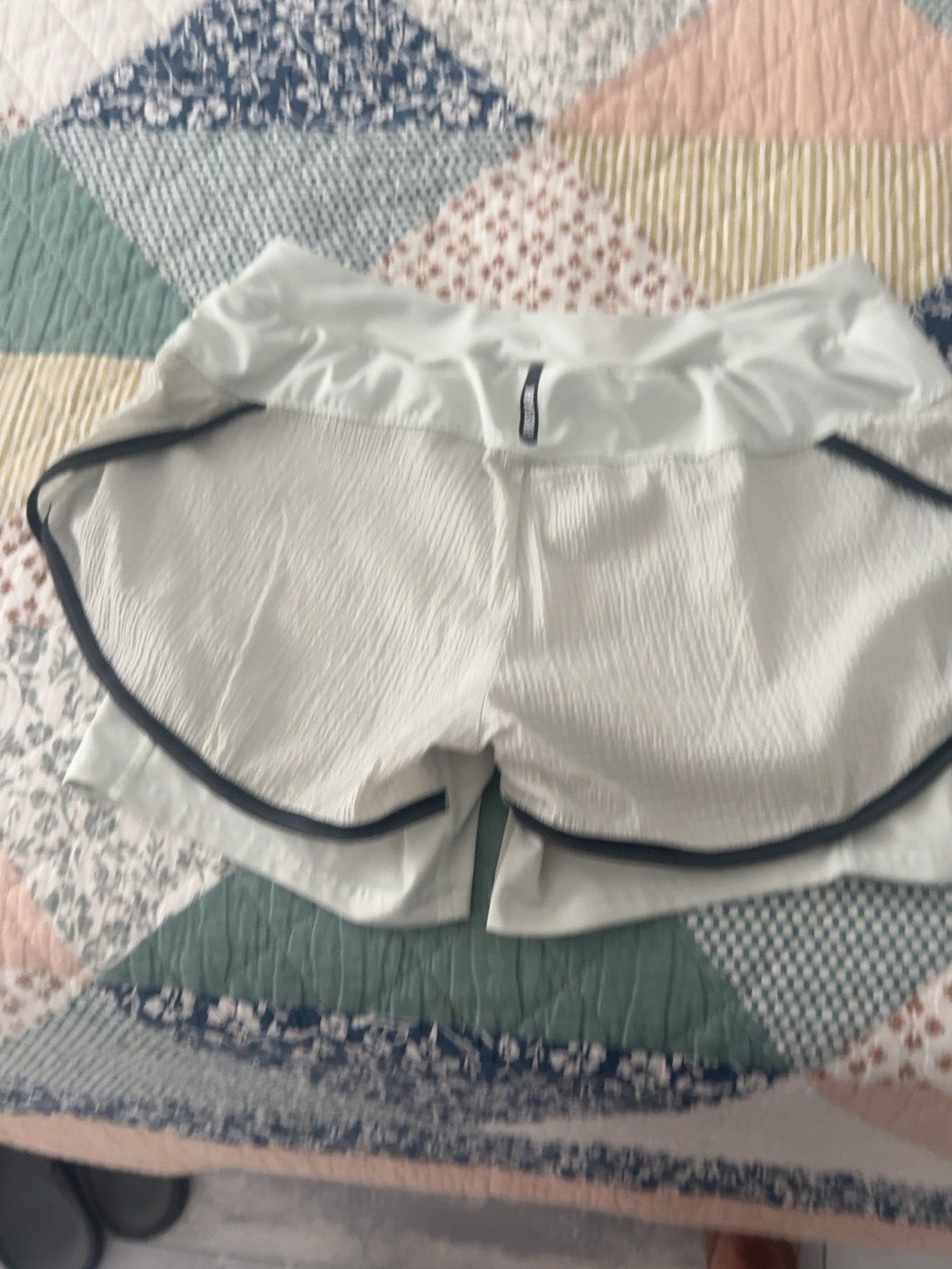 Gymshark White Athletic Ruffle Waist Shorts with Black Piping